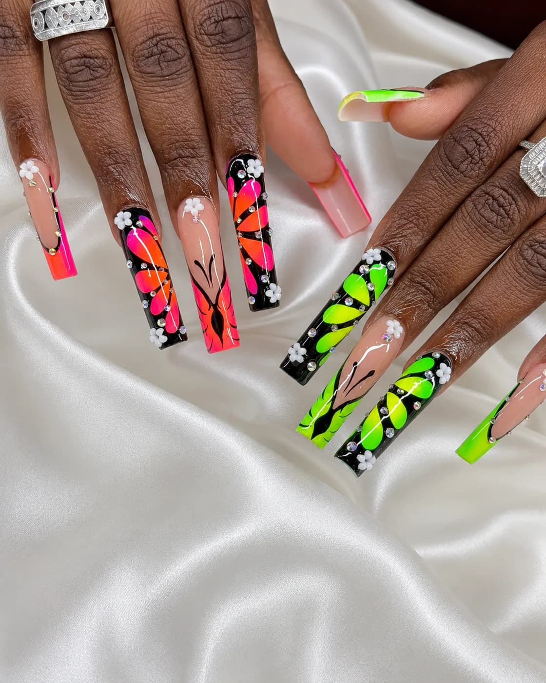 Extra-long square nails with neon pink, green and black abstract hand-painted art