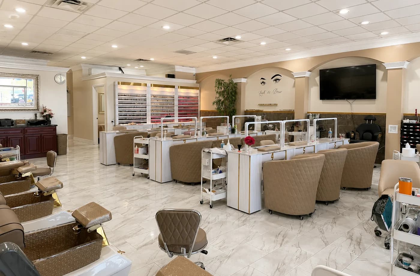 Wide view of the Utopia Nails Spa interior showing manicure stations and pedicure chairs
