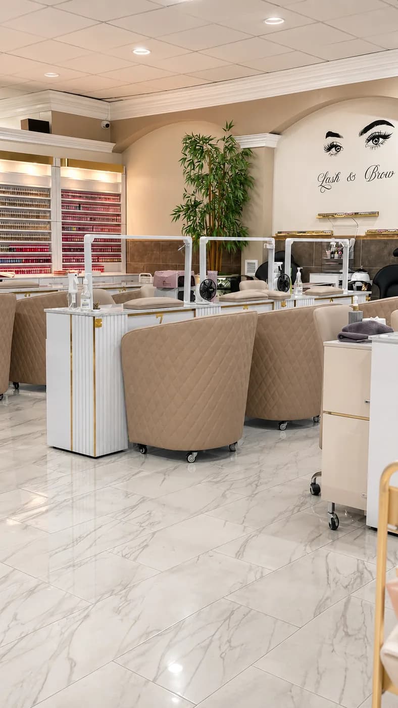 Manicure stations beside a polish colour wall at Utopia Nails Spa, West Palm Beach